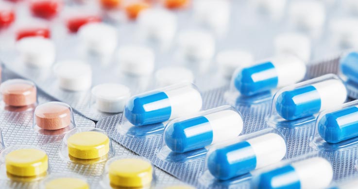 assorted pills in plastic and foil packaging